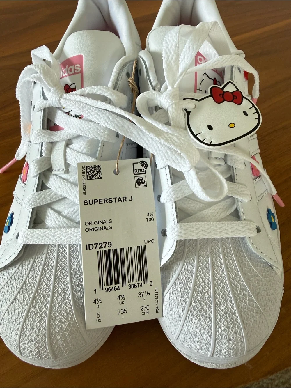 Adidas Youth Superstar J sneakers with Floral Accents & Hello Kitty Charm